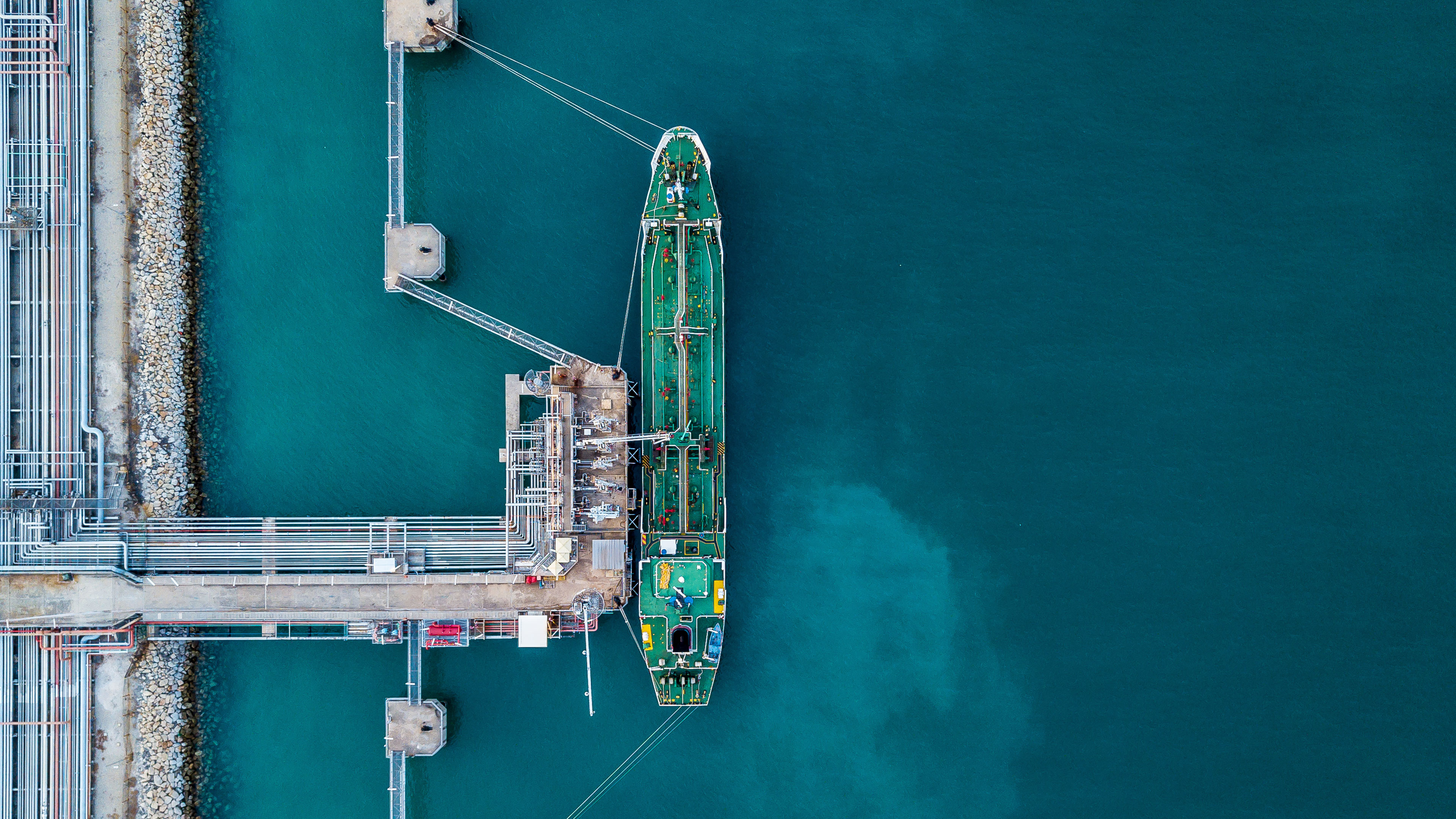 Aerial top view oil tanker ship under cargo operations